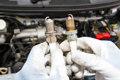 Mechanic Replacing Vehicle Spark Plug
