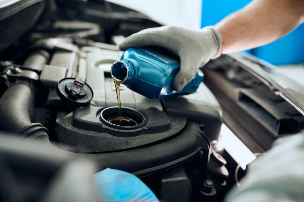 Car-Mechanic-Changing-Engine-Oil